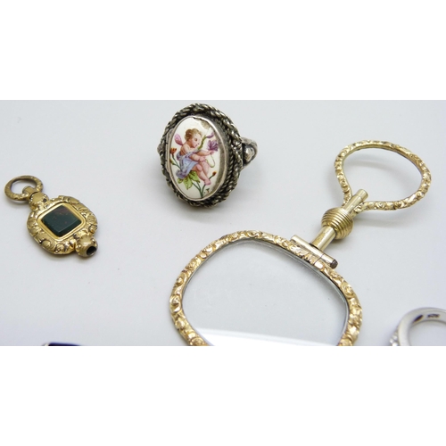 7095 - A gilt metal magnifying glass, a white metal poison ring with enamelled plaque, a Charles Horner sil... 