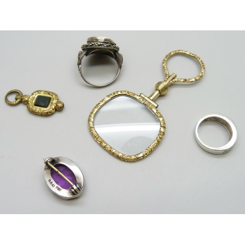 7095 - A gilt metal magnifying glass, a white metal poison ring with enamelled plaque, a Charles Horner sil... 