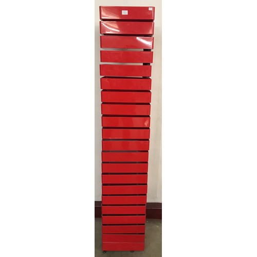 78G - A Shiro Kuramata style red Perspex revolving cabinet