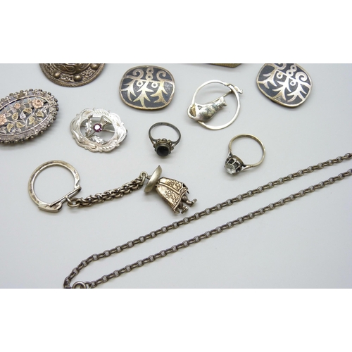 7101 - A collection of silver jewellery - two silver brooches including Victorian, a silver badge, a Mexica... 