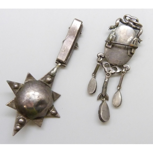 7108 - Two white metal drop pendants including a Victorian paste set starburst example, 17g