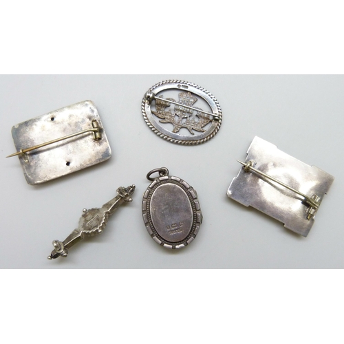 7117 - A Victorian silver locket, a Victorian silver brooch set with a stone, lacking pin, a silver thistle... 