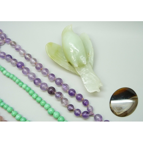 7118 - A carved green stone bird, a/f, 10.5cm, gemstone bead necklaces and brooches