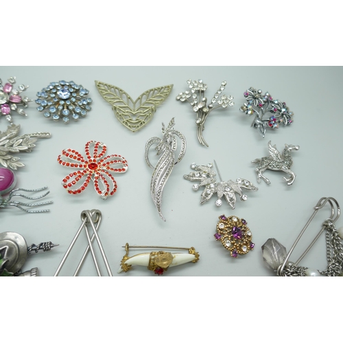 7142 - A collection of costume brooches including Art Nouveau style