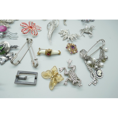 7142 - A collection of costume brooches including Art Nouveau style