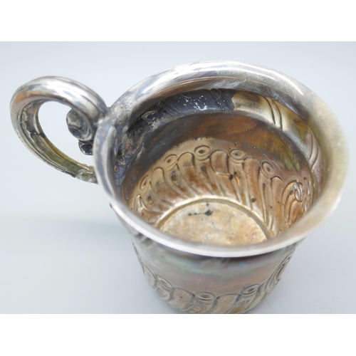 7232 - A small silver mug with embossed decoration, Birmingham 1904, a/f, 52g, 6.5cm