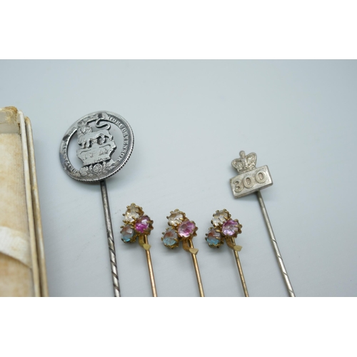 7234 - A 15ct gold diamond set stick pin, 1.5g, together with others including a silver example