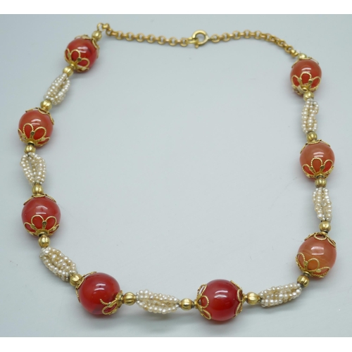 7237 - A carnelian and seed pearl necklace with gilt metal mounts, 40cm