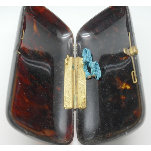 7255 - A late Victorian tortoiseshell case with gilt decoration, together with a silver bladed mother of pe... 