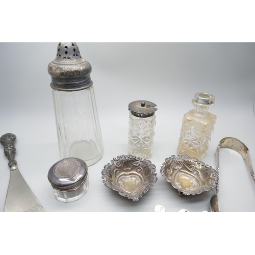 7257 - A collection of silver items including teaspoons, two dishes, sugar tongs, pots, etc., 196g of silve... 