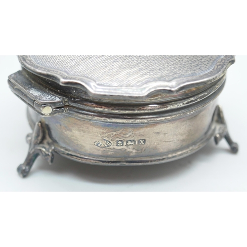 7259 - A silver jewellery casket with velvet interior, 6.2cm, 86g, and a white metal pot with control marks... 