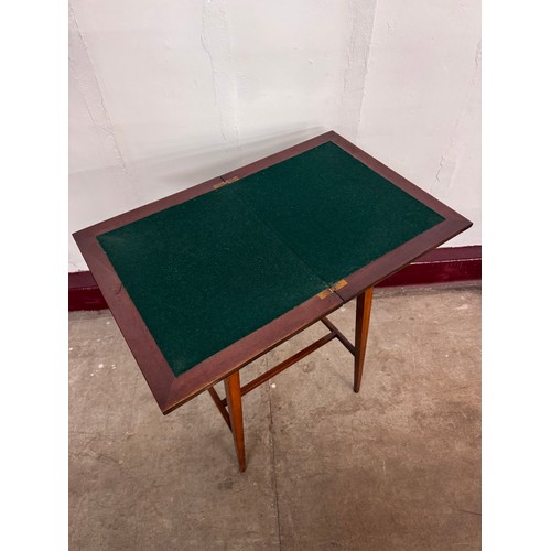 103A - An Edward VII inlaid mahogany fold over games table