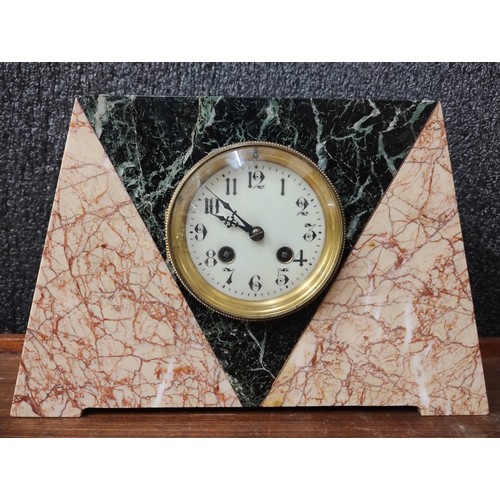 273 - A French Art Deco rouge marble mantel clock