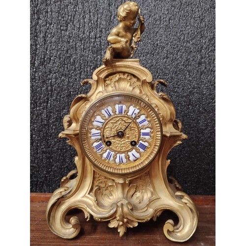 275 - A 19th Century French rococo-style ormolu mantle clock, the dial having enamel cartouche Roman numer... 