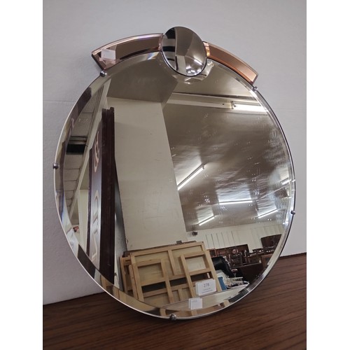 278 - An Art Deco bevelled edge mirror with peach glass