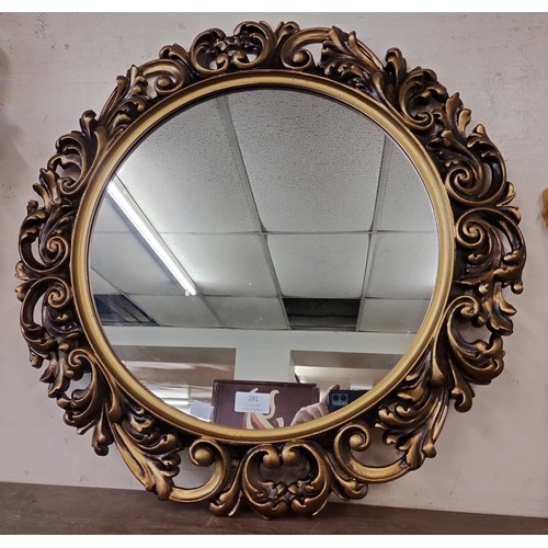 281 - A Rococo style circular gilt framed mirror