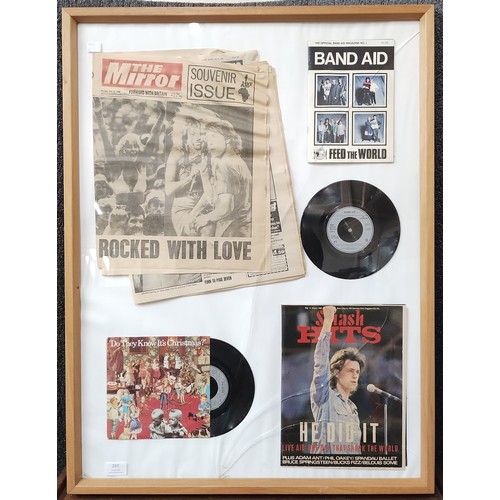 297 - A framed Band Aid commemorative display