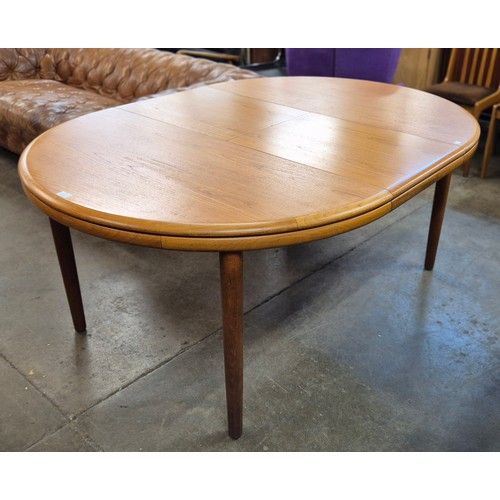 57 - A White & Newton teak circular extending dining table