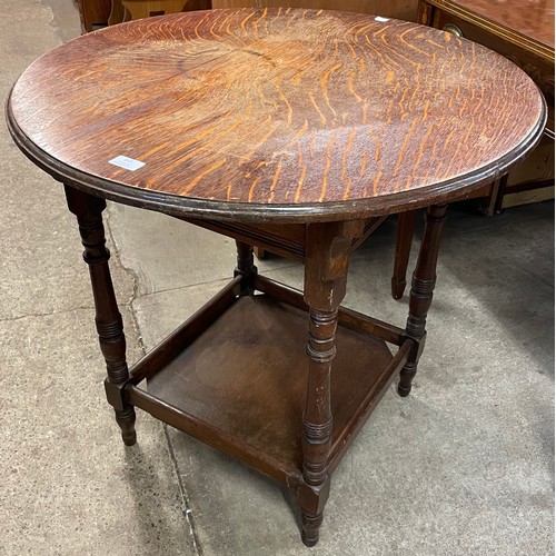 165 - An early 20th Century circular oak centre table