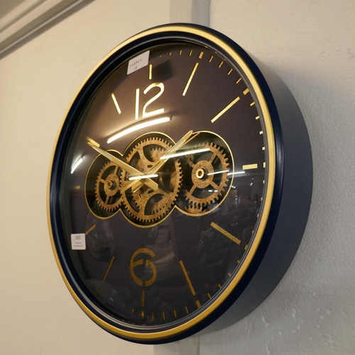 3033 - A navy/gold circle moving gear clock