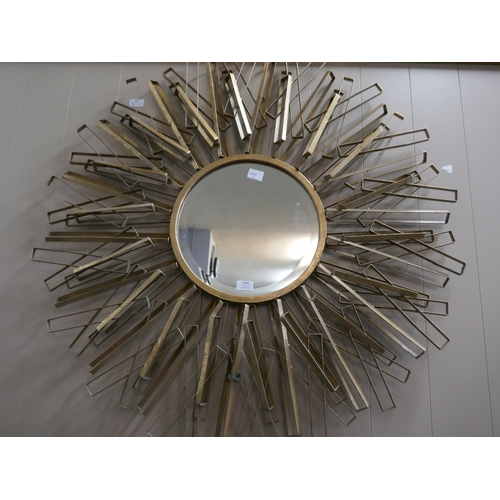 3046 - A large round metal mirror