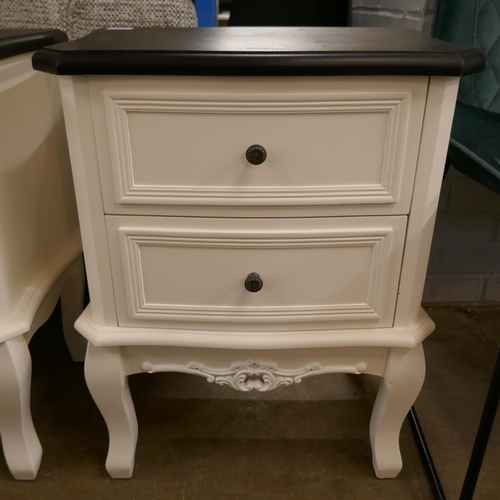 A white two drawer bedside with contrast top