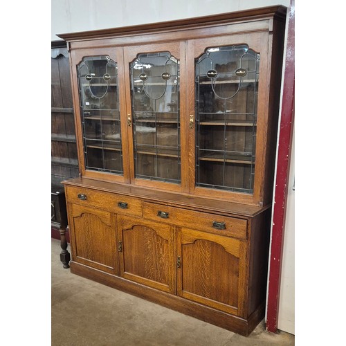 85 - An Arts & Crafts oak bookcase