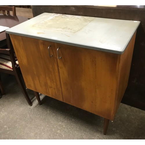 299 - A teak and Formica topped fitted cupboard