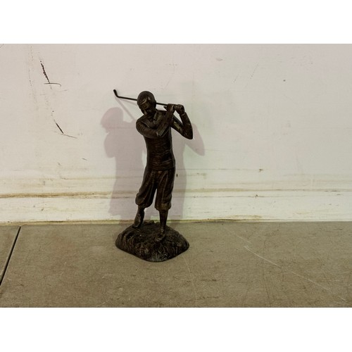 5092 - A bronze effect cast metal figure of a golfer * This lot is subject to VAT