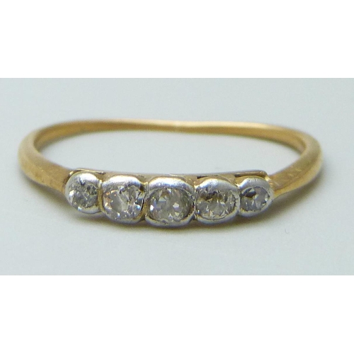 7003 - A yellow metal and diamond ring, 1.2g, and a 9ct gold wedding band, 0.6g, K