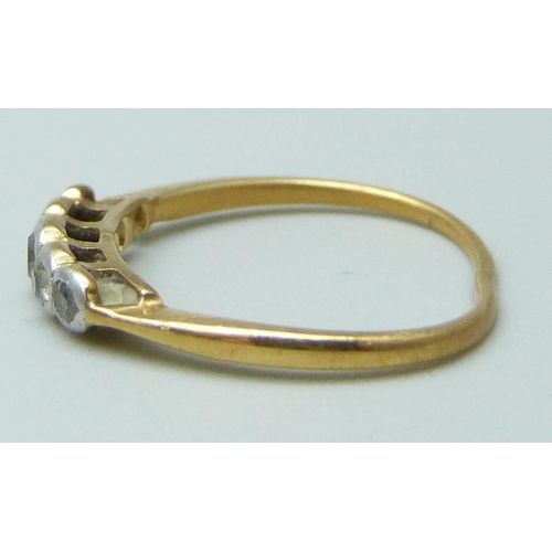 7003 - A yellow metal and diamond ring, 1.2g, and a 9ct gold wedding band, 0.6g, K