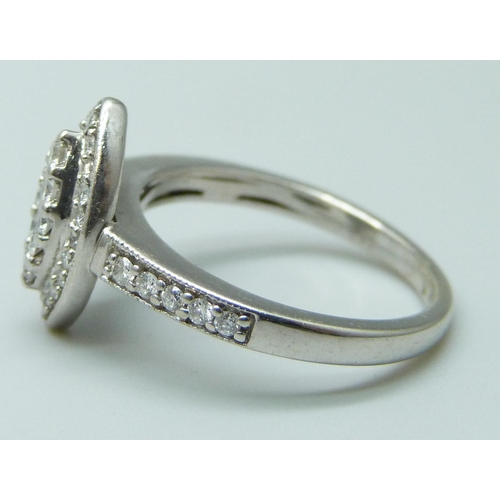 7006 - An 18ct white gold marquise ring set with diamonds, 3.8g, K