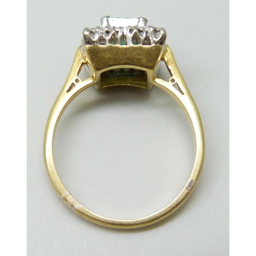 7010 - An 18ct gold, emerald and diamond cluster ring, 4.9g, O