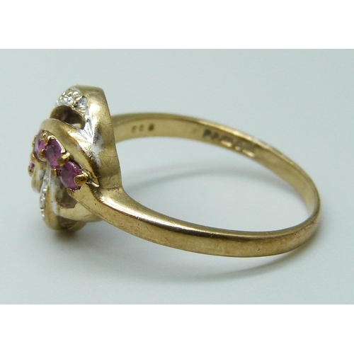 7014 - A 9ct gold, diamond and ruby ring, 2.9g, P/Q