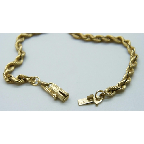 7015 - A 9ct gold rope twist chain, the end link set with a small diamond, 17.6g, 47.5cm