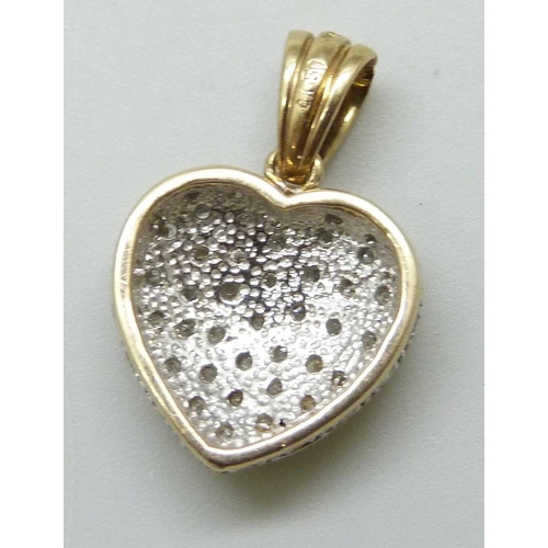 7029 - A 9ct gold heart shaped pendant set with 0.5ct of diamonds to front and edge, stamped .50 and hallma... 