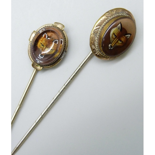 7030 - Two gilt metal stick pins with fox detail, largest top 2.1 x 1.8cm, both in fitted jewellery box