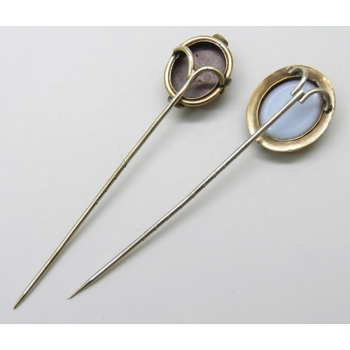 7030 - Two gilt metal stick pins with fox detail, largest top 2.1 x 1.8cm, both in fitted jewellery box