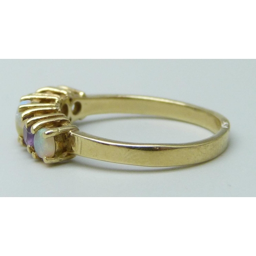 7031 - A 9ct gold, opal and amethyst ring, 2.4g, N