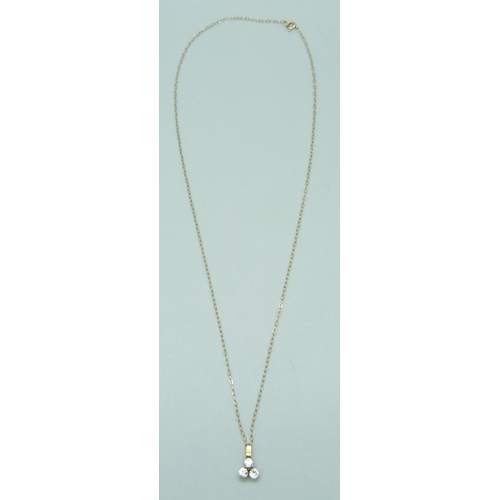 7035 - A yellow metal and white stone pendant on a 9ct gold chain, 0.7g, 40cm chain, 1cm pendant