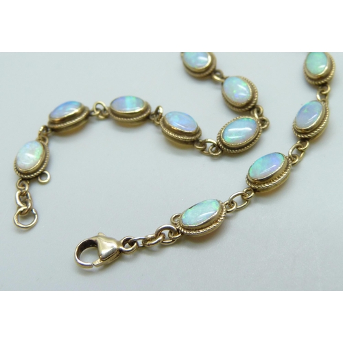 7060 - A 9ct gold opal set bracelet, 4.8g, 18.5cm