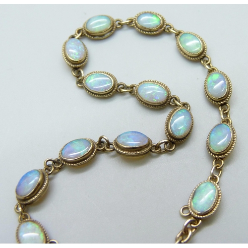 7060 - A 9ct gold opal set bracelet, 4.8g, 18.5cm