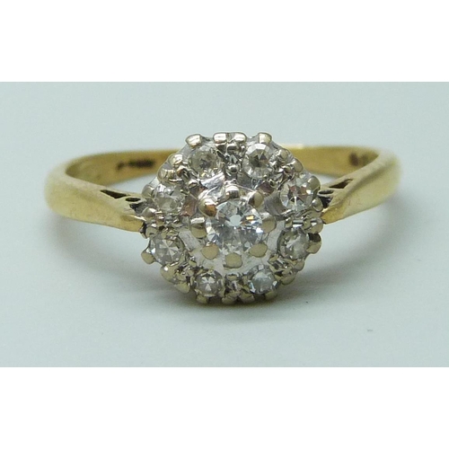 7062 - An 18ct gold diamond cluster ring, 3g, O