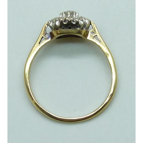 7062 - An 18ct gold diamond cluster ring, 3g, O