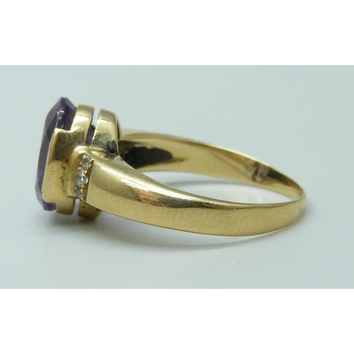 7064 - A 14k gold, amethyst and white stone set ring, 4.6g, N