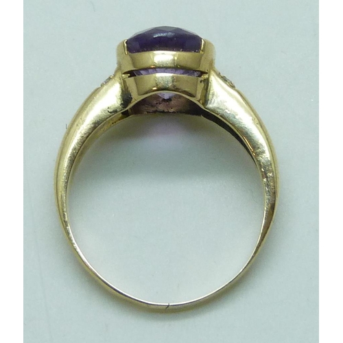 7064 - A 14k gold, amethyst and white stone set ring, 4.6g, N