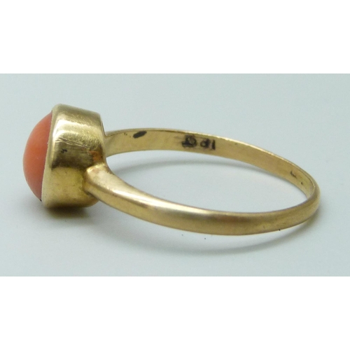 7066 - A yellow metal coral set ring, stamped 18ct, 2.5g, O