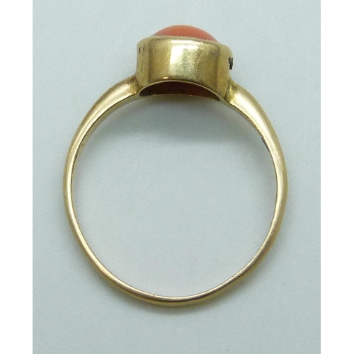 7066 - A yellow metal coral set ring, stamped 18ct, 2.5g, O