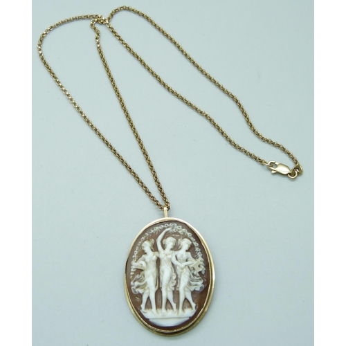 7069 - A yellow metal cameo pendant/brooch depicting three ladies, on a 9ct gold chain, 4.5cm including bal... 