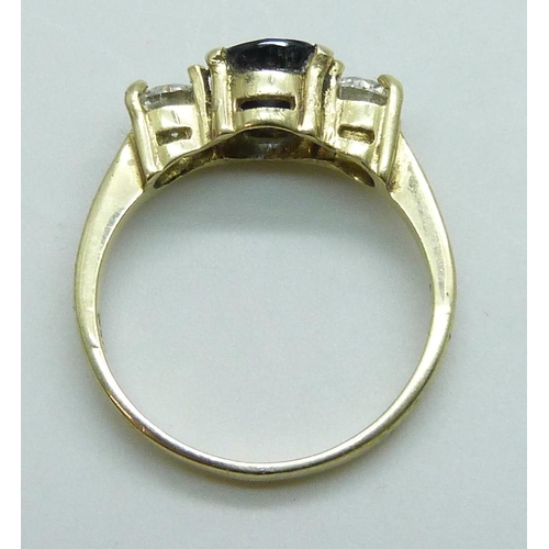 7070 - An 18ct gold, sapphire and diamond ring, approximately 0.75ct total diamond weight, 3.9g, Q, in a ri... 